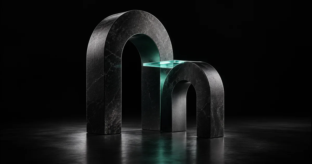 Two dark stone arches are connected by a transparent teal glass bridge.
